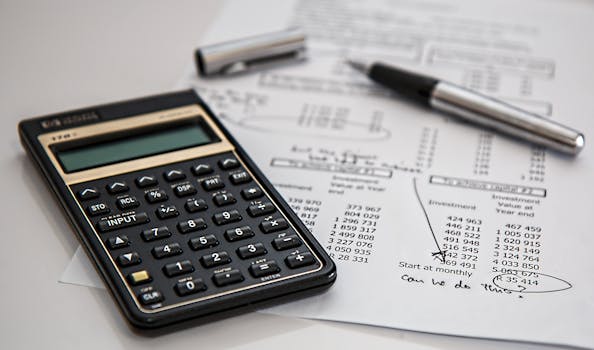 calculator-calculation-insurance-finance-53621-53621 Close-up of financial documents with calculator and pen, ideal for business management themes.