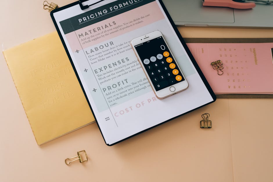pexels-photo-8970670-8970670 Organized business tools with a smartphone, documents, and stationery in a flat lay format.