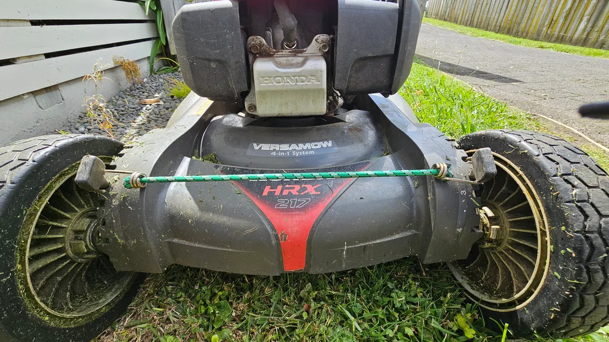 Front of a Honda HRX mower after a job