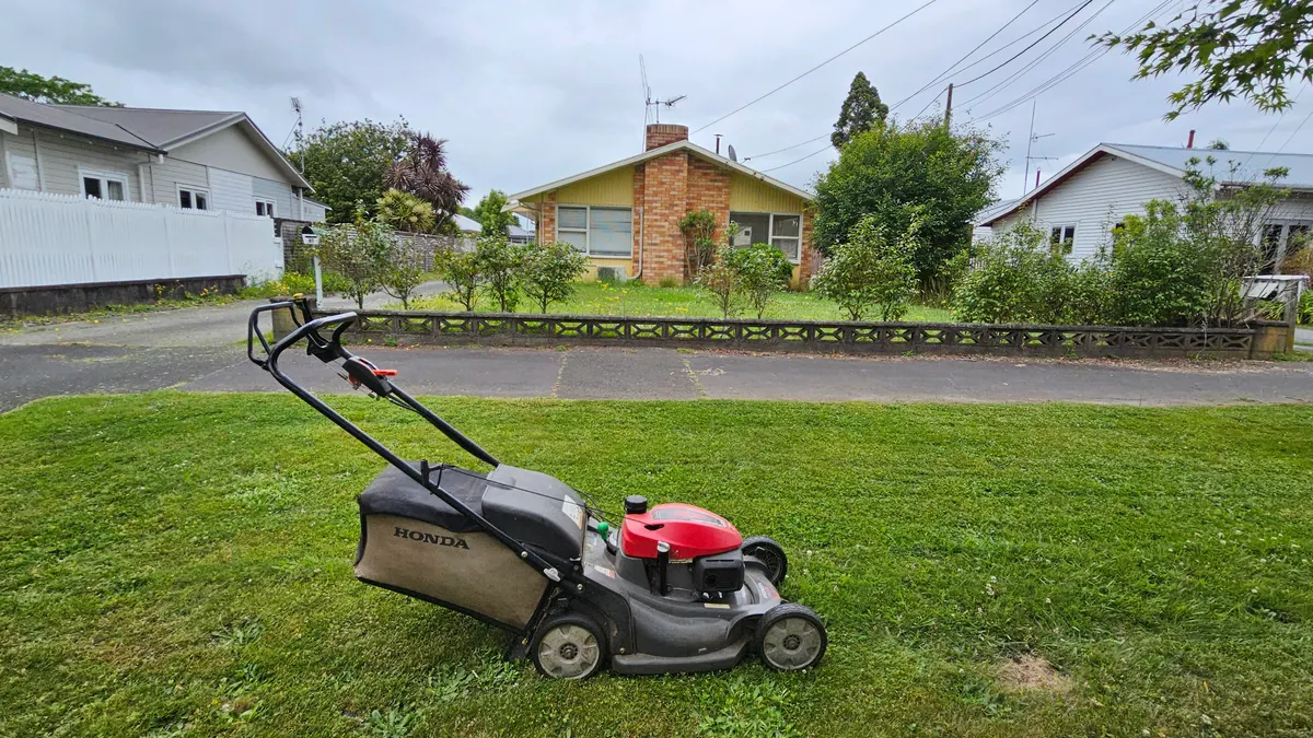 Honda mower on a sloping front lawn