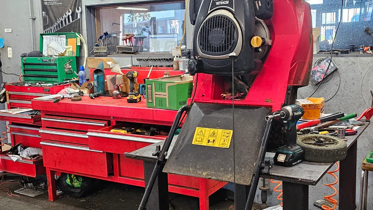 Mower on the workbench at a local repair shop