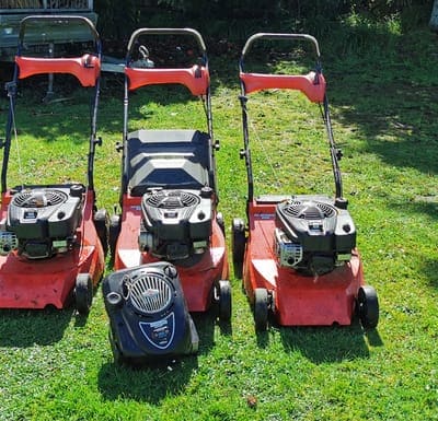 Three mowers lined up ready for work